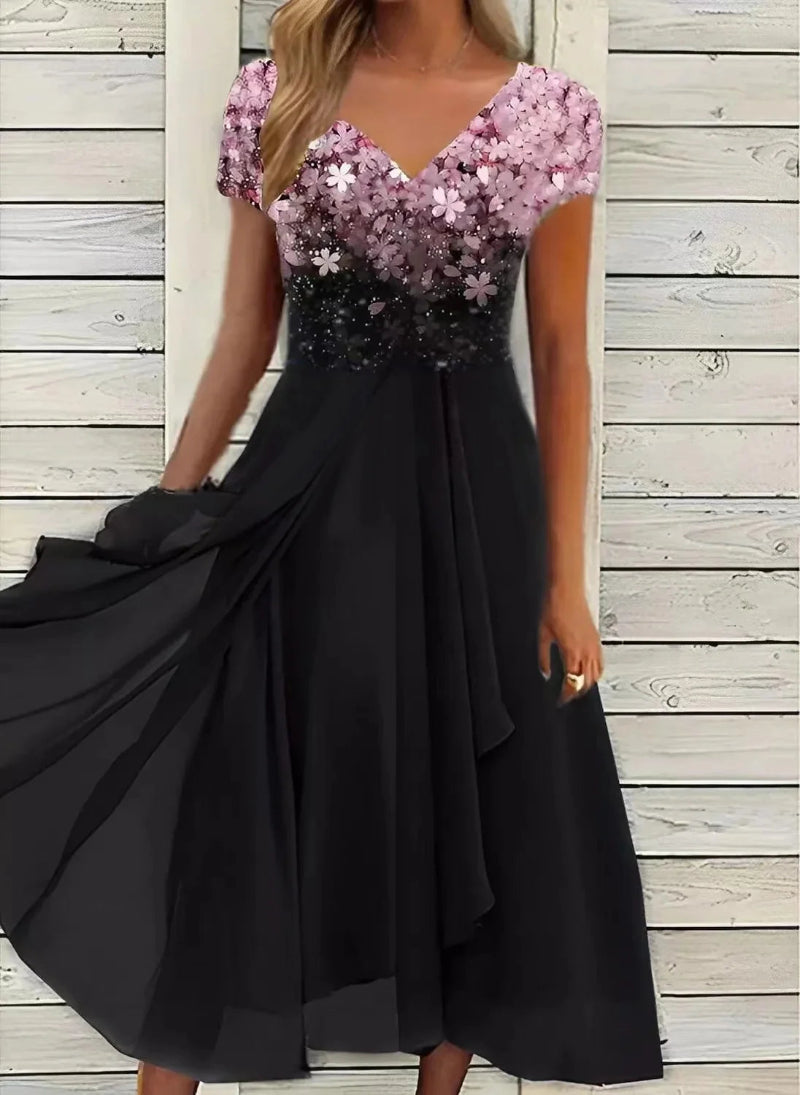 Black dress with pink sequin top against a wooden background