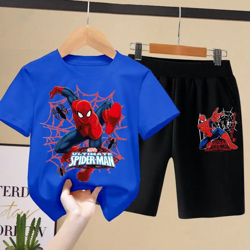 Blue t-shirt with Spider-Man graphic and black shorts on a hanger against a beige wall.