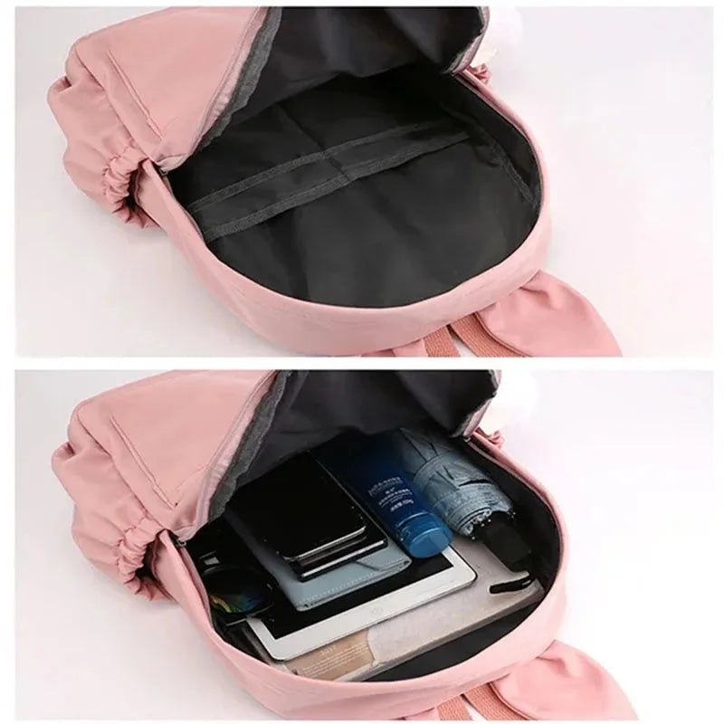 Pink backpack with compartments showing organized items on a white background