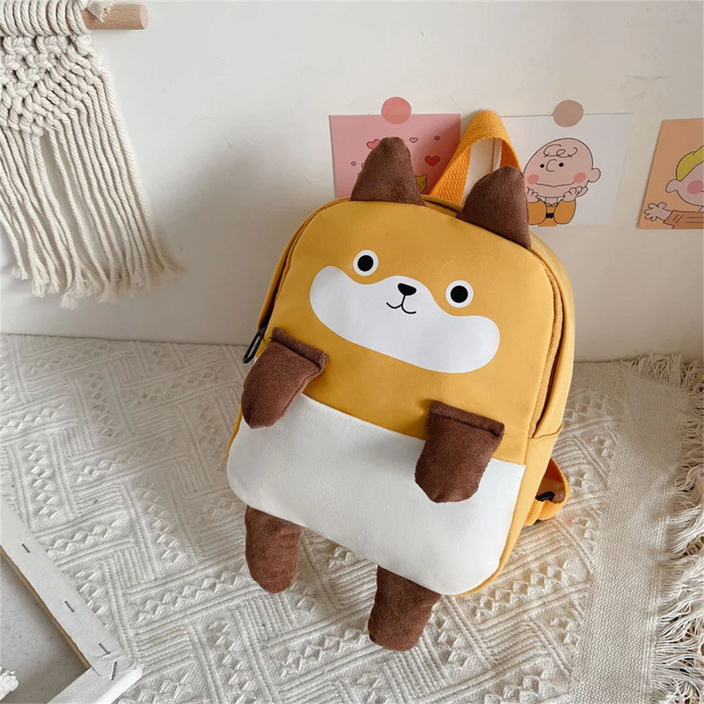 Children's backpack with a cartoon dog design on a textured surface
