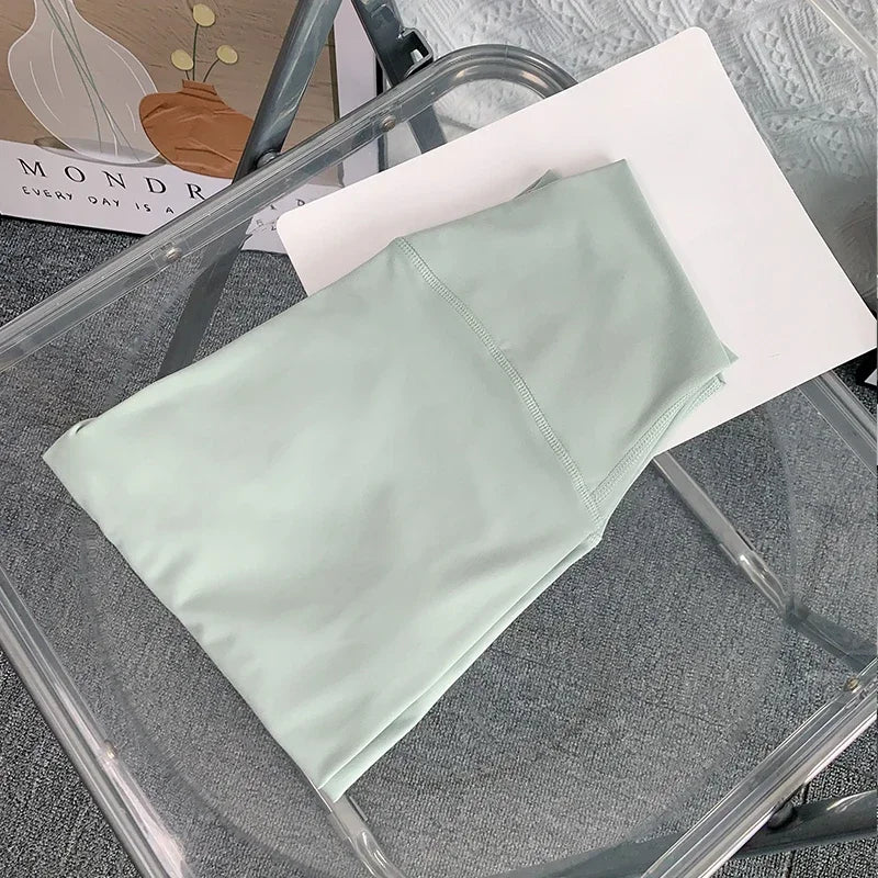 Light green fabric on a clear plastic chair with a blurred background