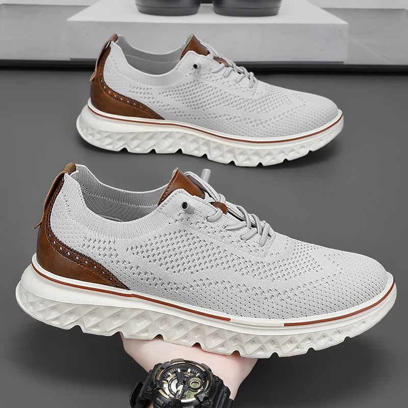 White sneakers with brown accents on a gray surface