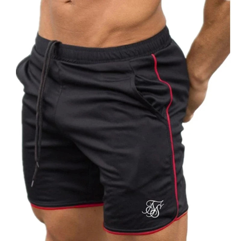 Black shorts with red piping on a white background