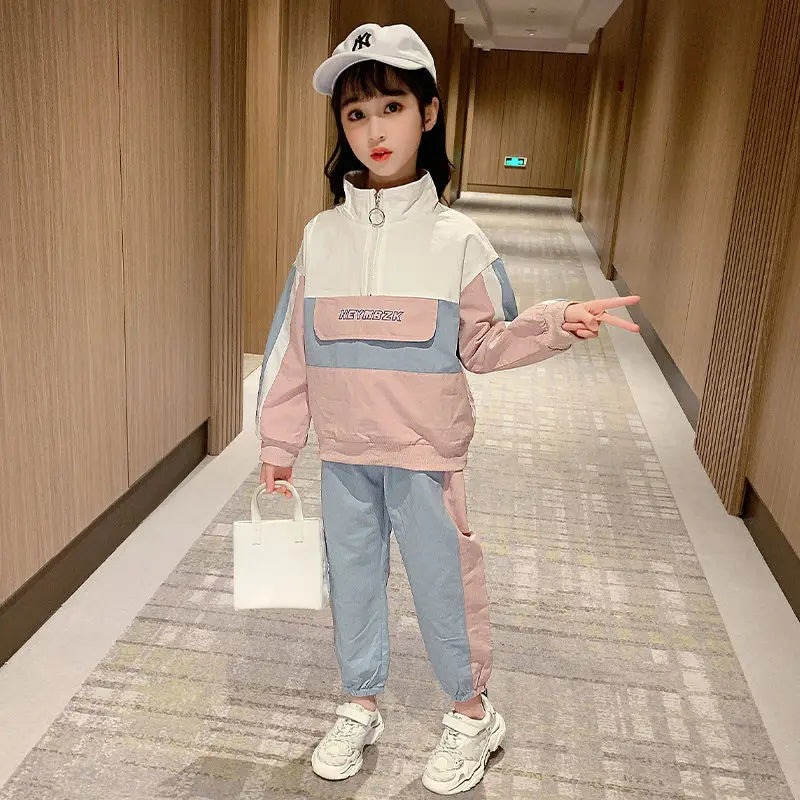 Child wearing a colorful outfit with a cap in a hallway