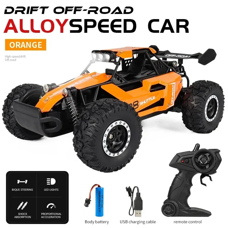 Orange off-road alloy speed car with remote control and accessories on a white background