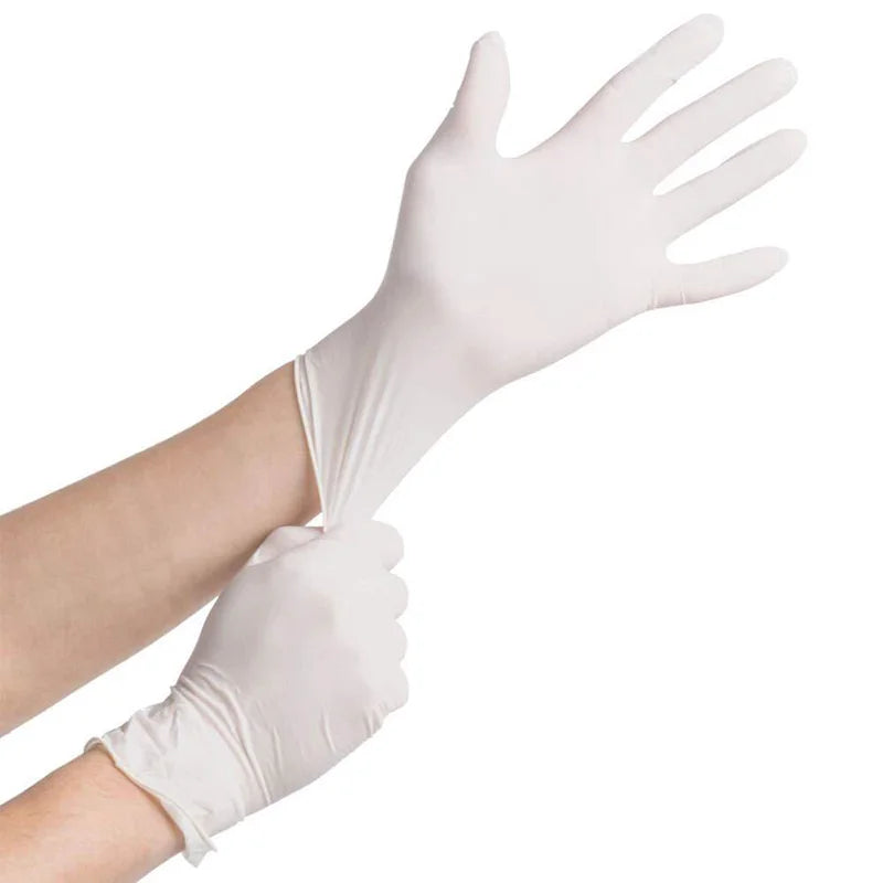 White gloves being worn on a white background