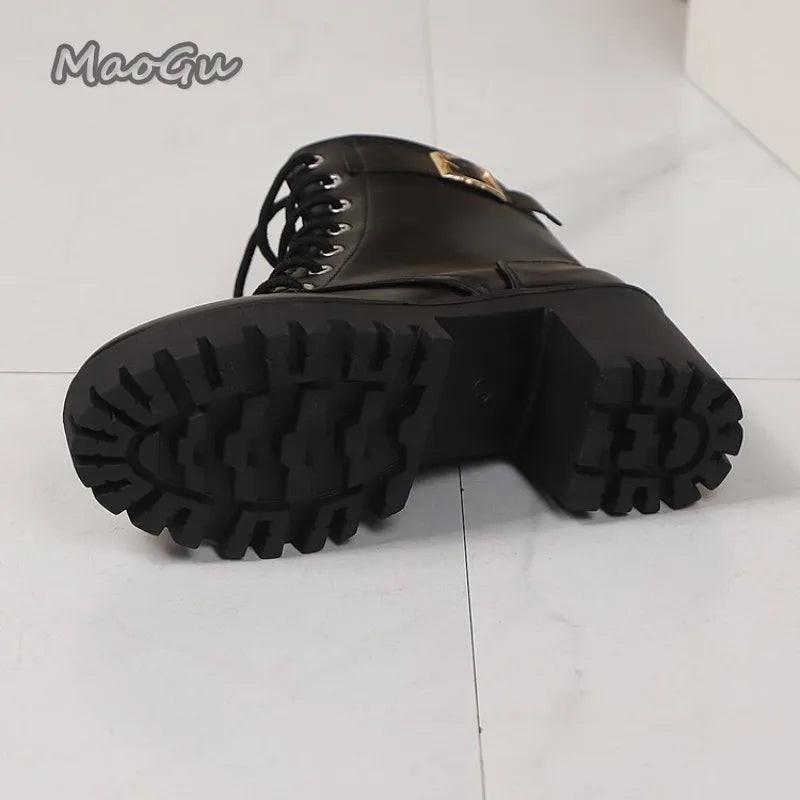 Black boot with thick sole on a light gray background, featuring the brand 'MaoGu'.