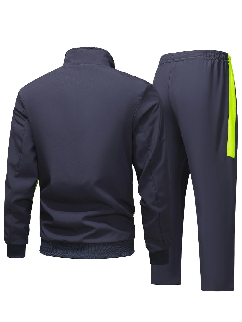 Navy tracksuit with a yellow stripe on the pants against a white background