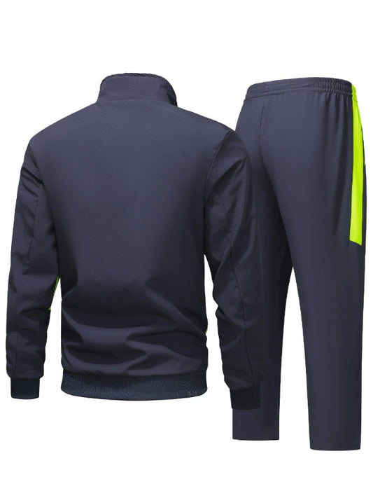 Navy tracksuit with a yellow stripe on the pants against a white background