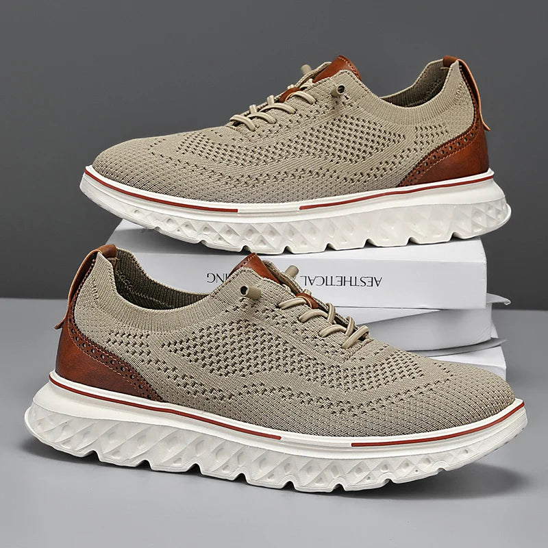 Pair of beige and brown sneakers with white soles on a gray background