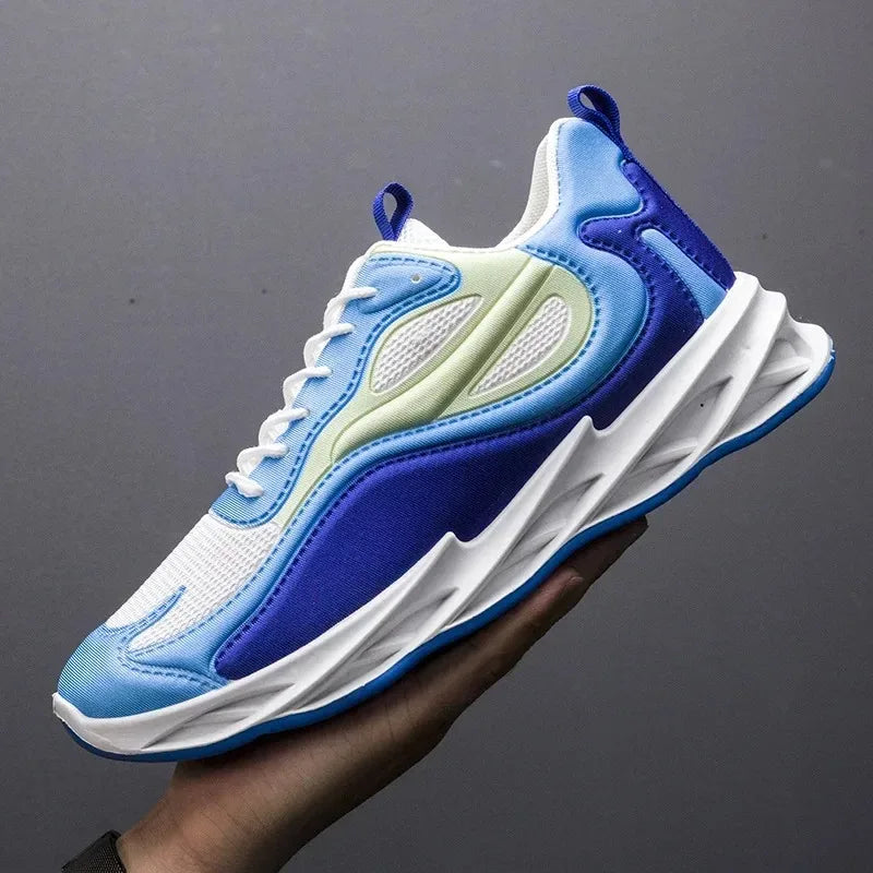 Blue and white sneaker held by a hand against a dark background