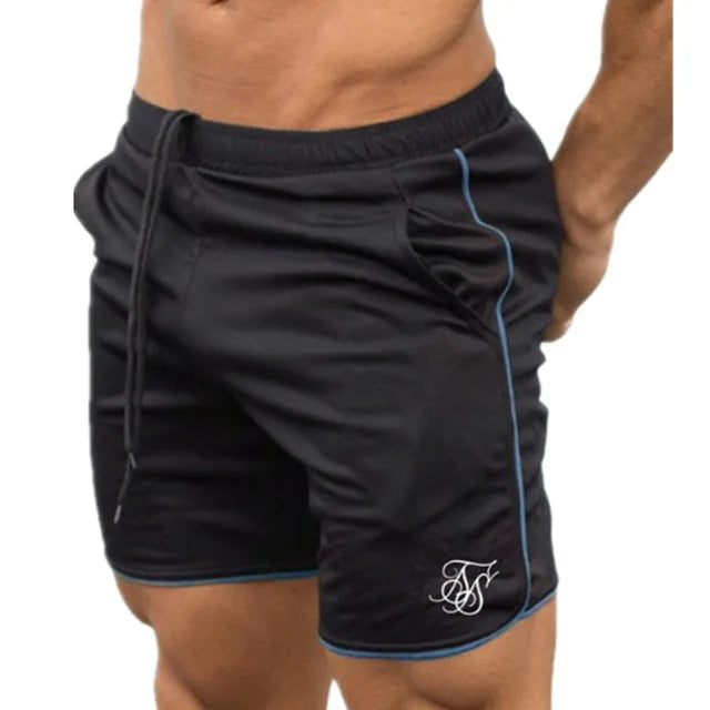 Black athletic shorts with a logo on a white background