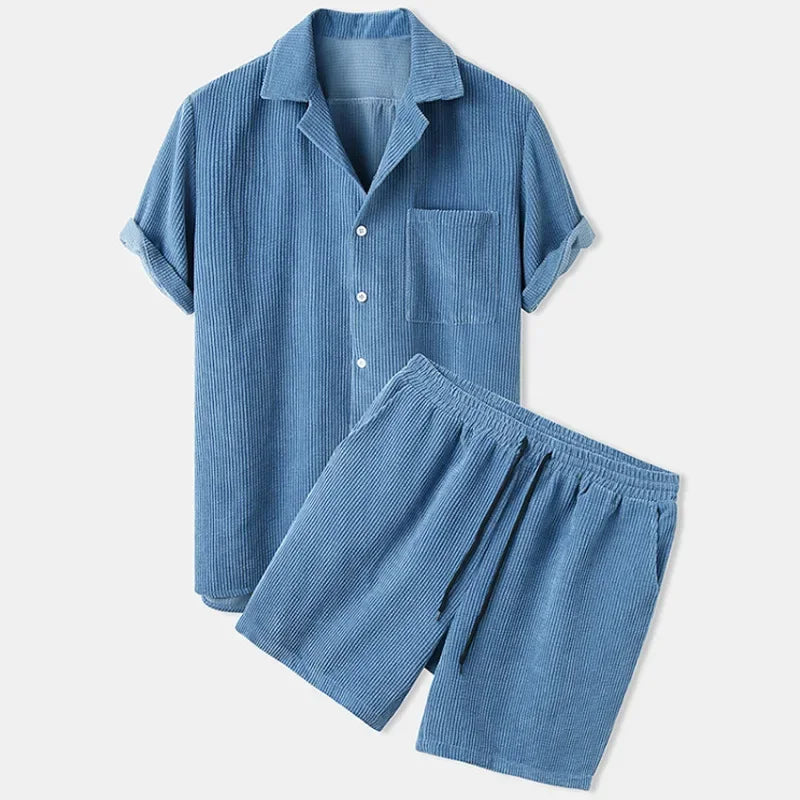 Blue pajama set with shirt and shorts on a white background