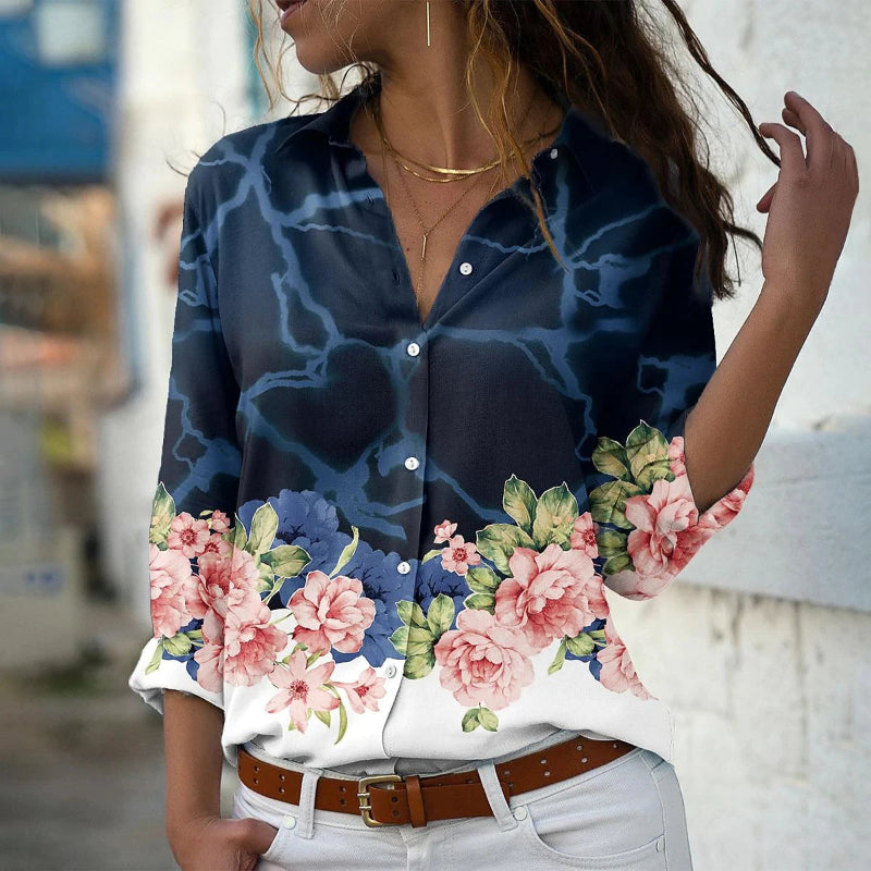Woman wearing a floral blouse with a blurred background