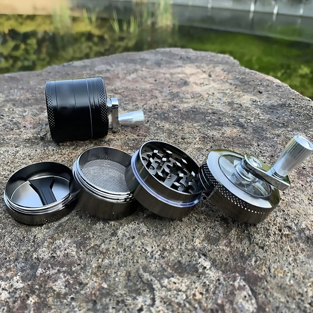 Black metal grinder on a stone surface with a blurred natural background