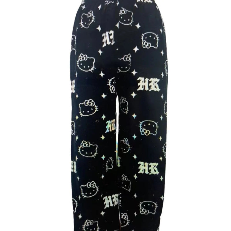 Black pajama pants with Hello Kitty logo pattern on a white background
