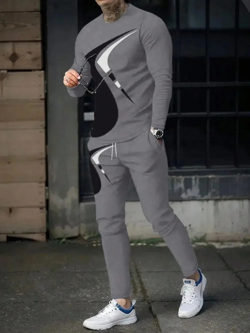 Man wearing a gray tracksuit with black accents in an urban setting