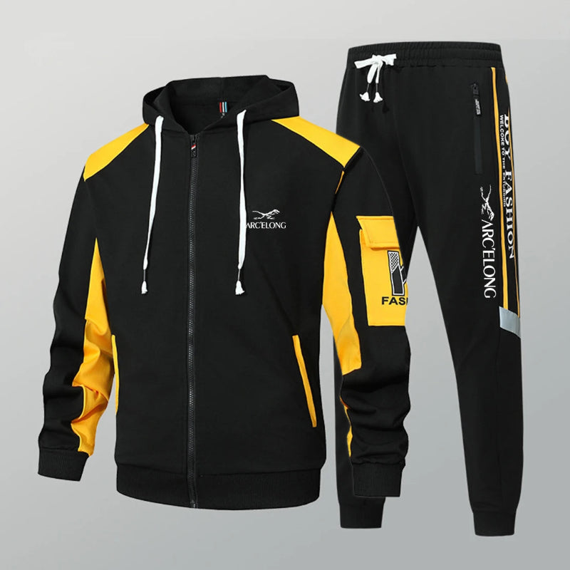 Black and yellow tracksuit with visible branding on a gray background