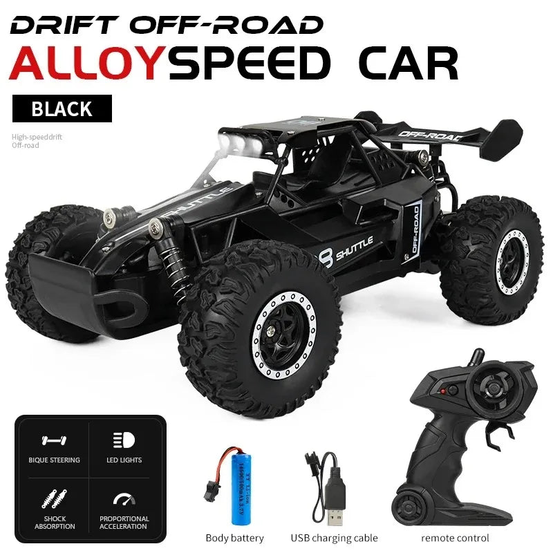 Black alloy speed car with remote control and accessories on a white background