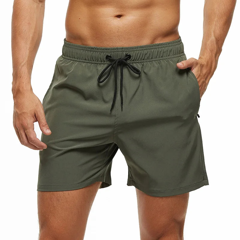Green shorts with a drawstring on a white background