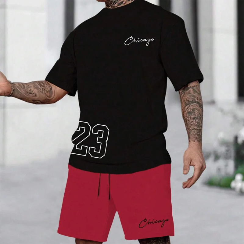 A man wearing a two-piece summer suit with a short-sleeve t-shirt and matching shorts, both featuring a bold 'Los Angeles' 3D print design in black and white.
