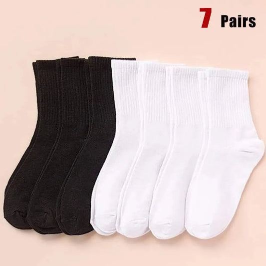 7 pairs of black and white mid-length breathable unisex socks for casual and sportswear- black and white