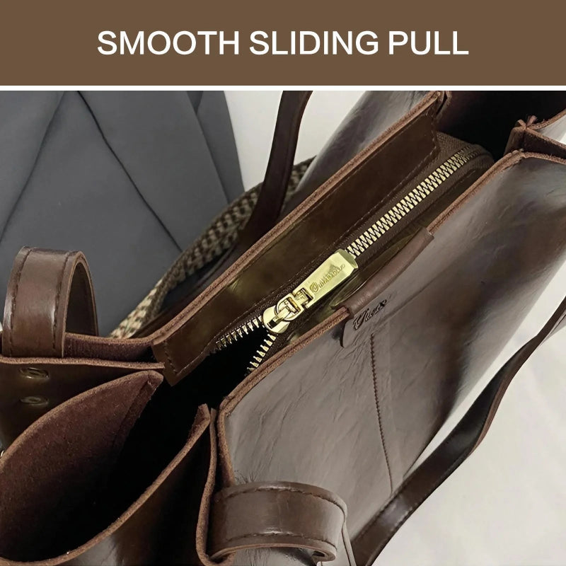 Brown leather bag with gold zipper and 'Chloe' branding, featuring a smooth sliding pull.