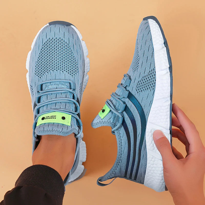 sneakers designed with breathable mesh and cushioned soles for all-day comfort in sports and casual wear. blue