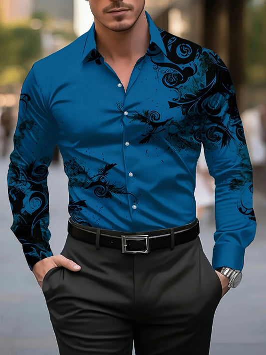 Man wearing a blue shirt with black floral patterns and black pants.