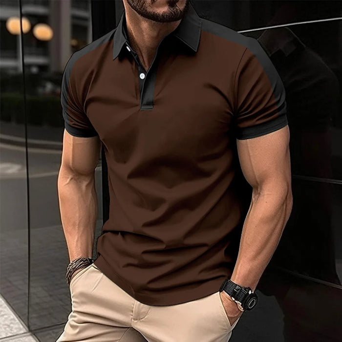 A man wearing a red and black patchwork polo shirt with short sleeves and a collar.