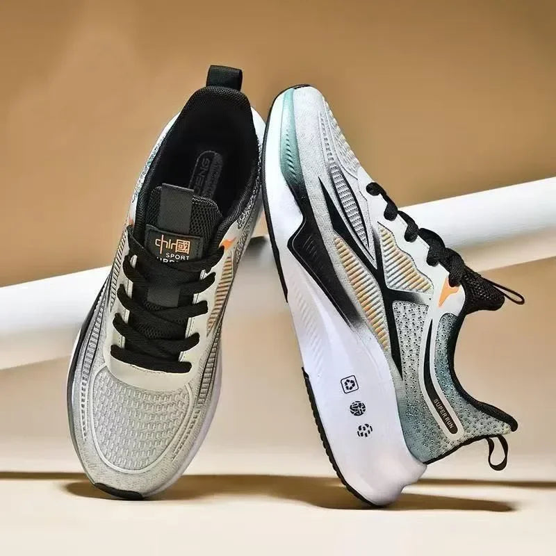 Pair of white and black athletic shoes on a beige background