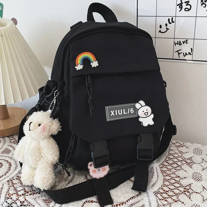 Black backpack with decorative elements on a textured surface