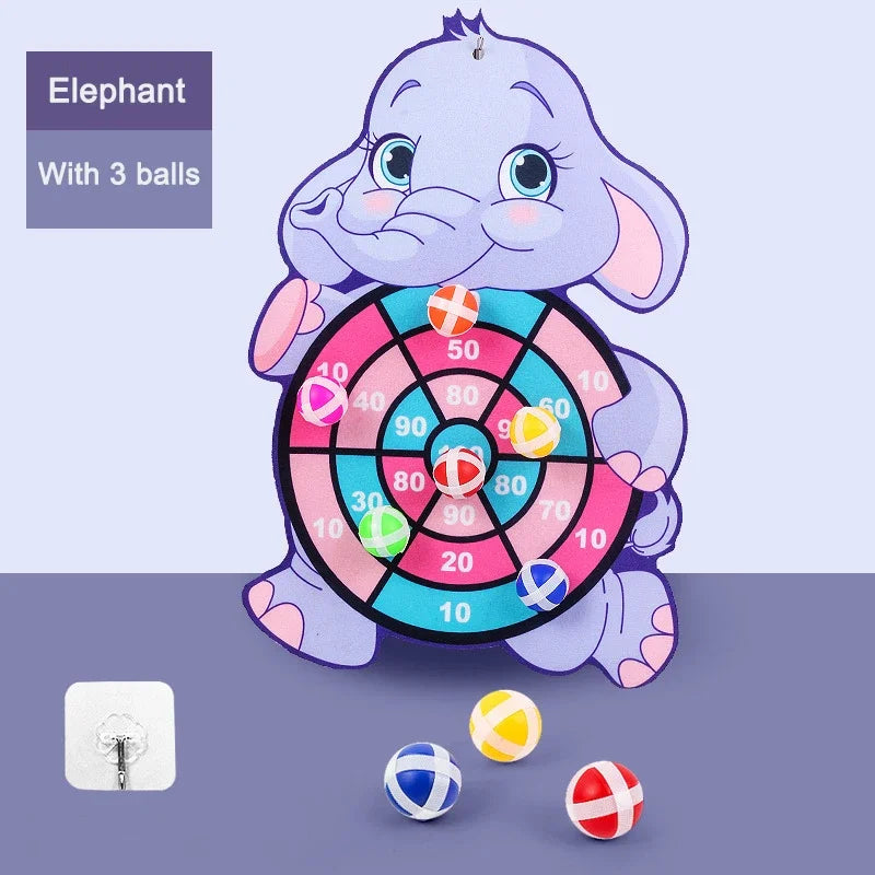 Children's dartboard toy shaped like an elephant with three balls on a purple background