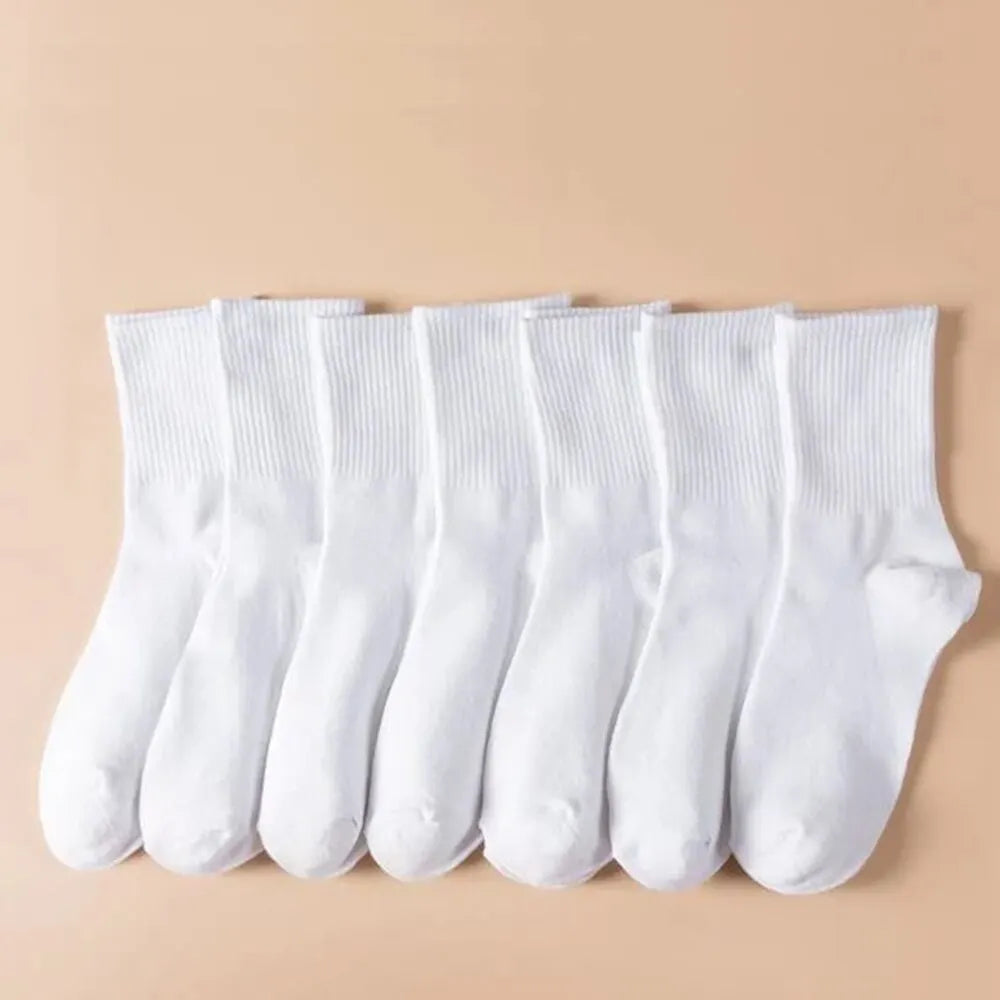 7 pairs of black and white mid-length breathable unisex socks for casual and sportswear- seven white