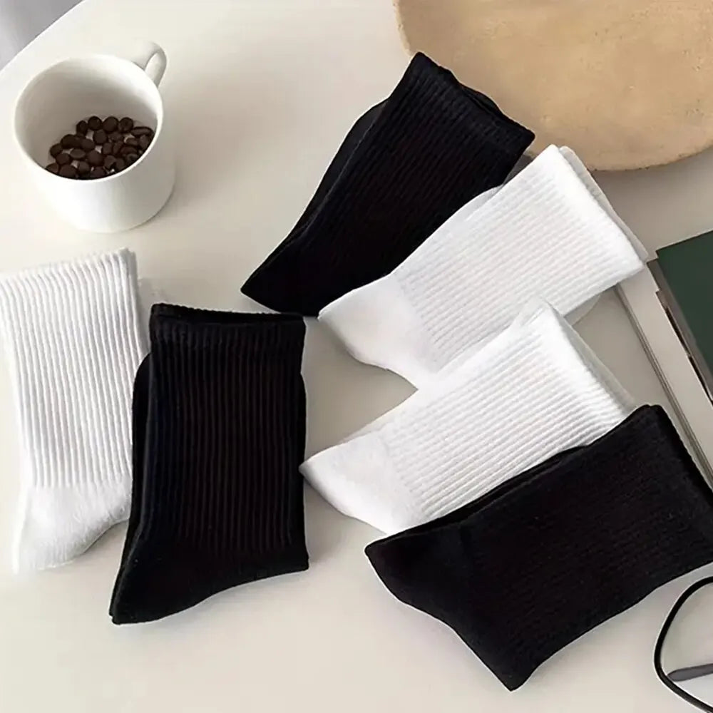 7 pairs of black and white mid-length breathable unisex socks for casual and sportswear - white and black