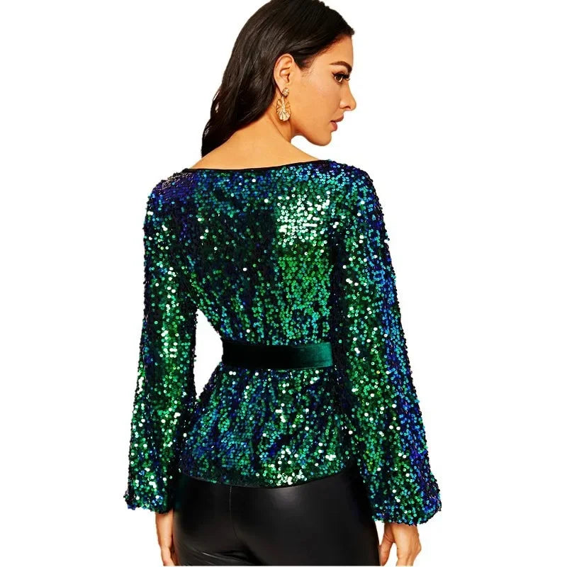 Green sequin top worn by a model on a white background