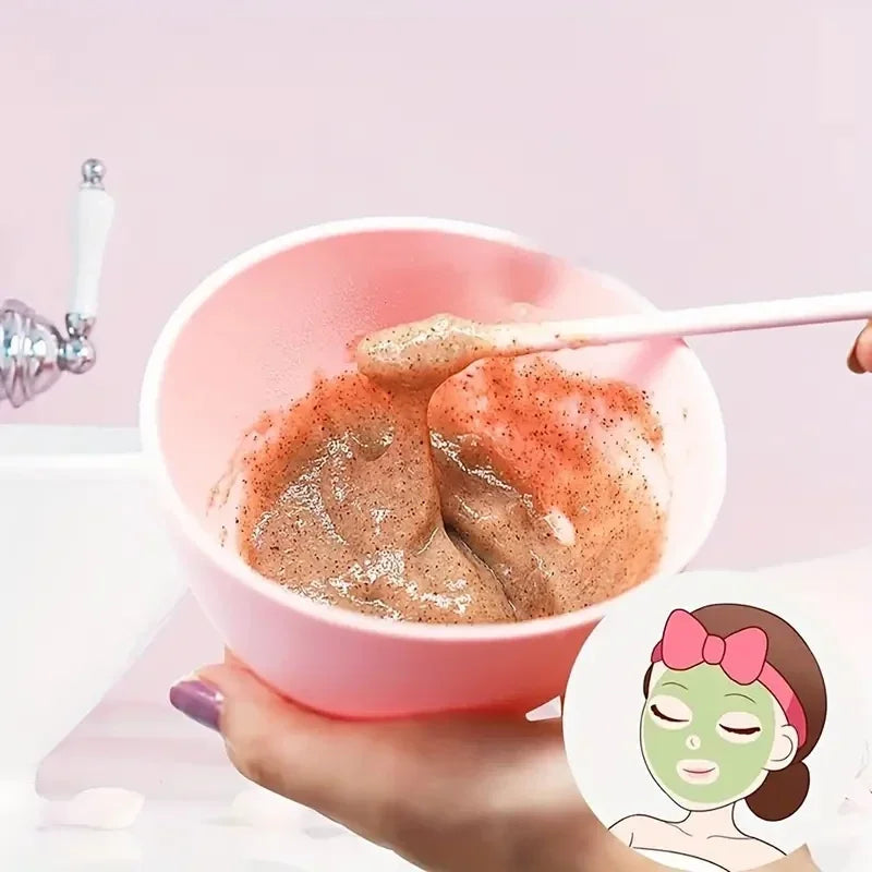 Pink bowl with scrub and a spoon, with a cartoon of a woman wearing a green mask.
