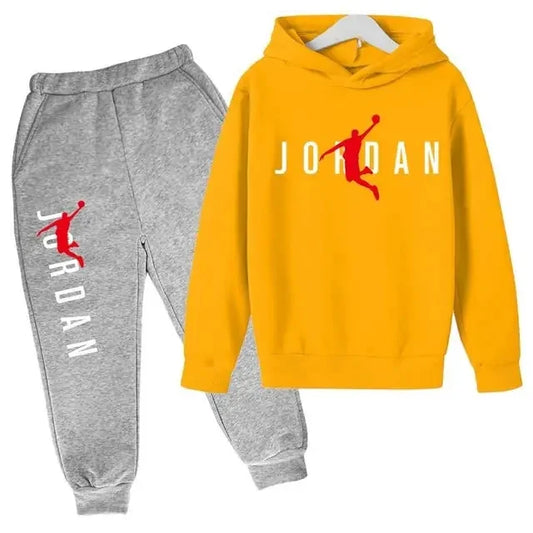 Yellow hoodie and gray sweatpants with Jordan logo on a white background
