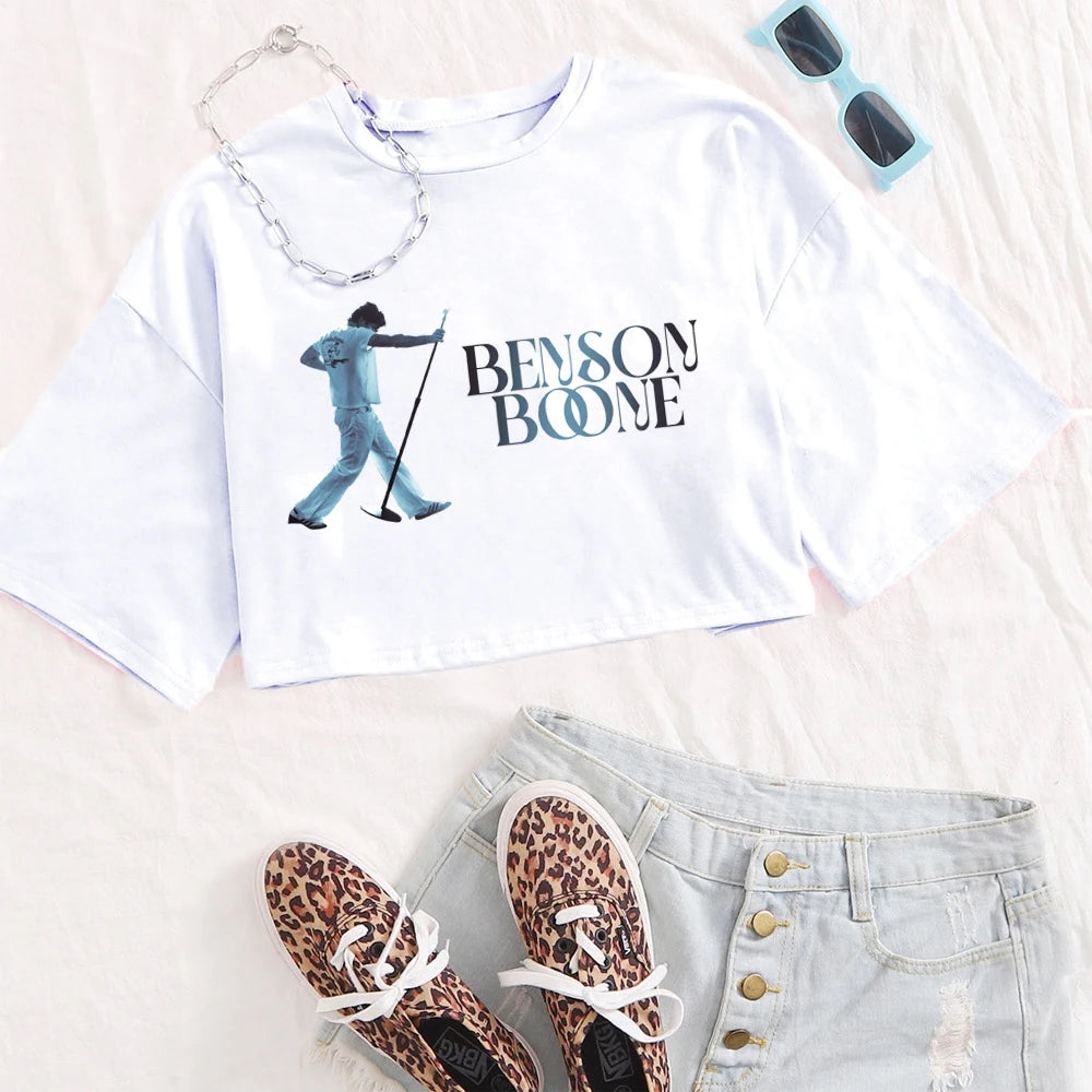 White t-shirt with 'Benson Boone' graphic, leopard print shoes, denim shorts, and sunglasses on a light background