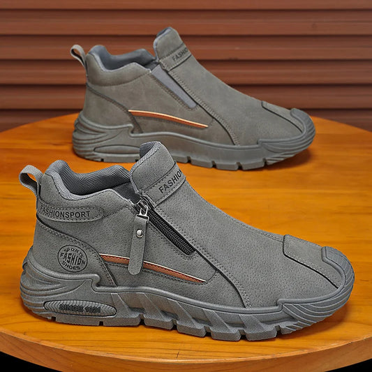 Gray slip-on shoes with a zipper on a wooden surface