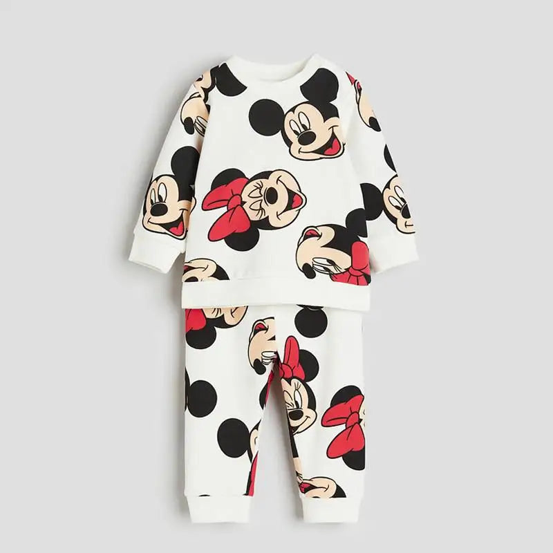 Children's pajama set with cartoon character design on a light gray background