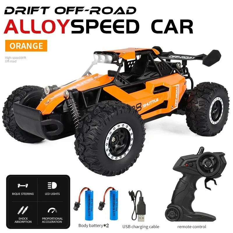 Orange alloy speed car with remote control and accessories on a white background