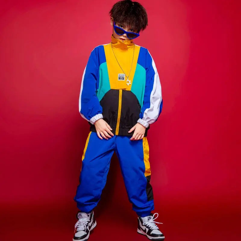 Person wearing a colorful outfit with a red background