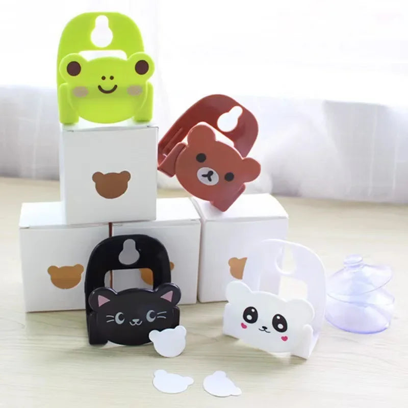 Set of cartoon-shaped bottle openers on white blocks with a light gray background