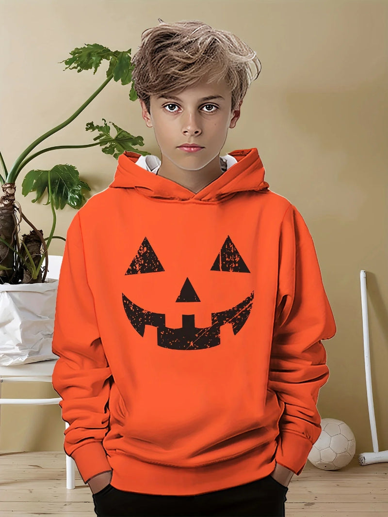 A boy wearing a black hoodie with a 3D print of a toy bear wearing sunglasses.
