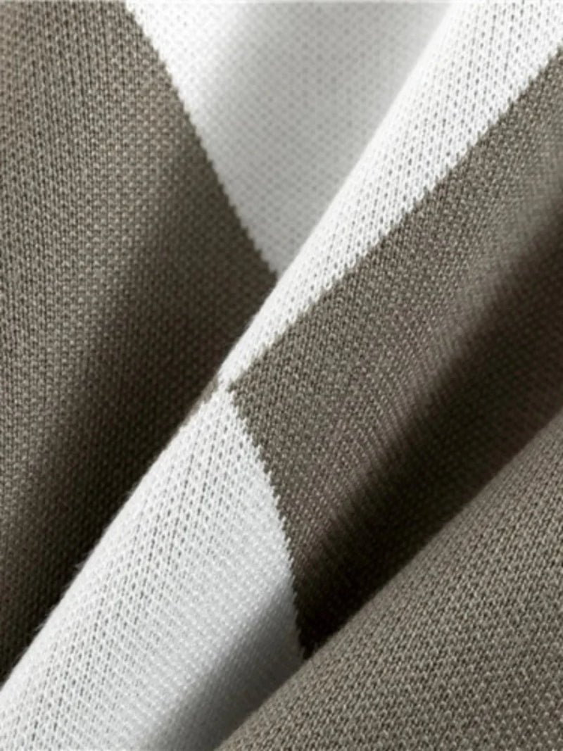 Close-up of gray and white fabric with a subtle pattern