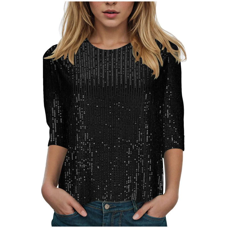 Black sequin top worn by a person on a white background
