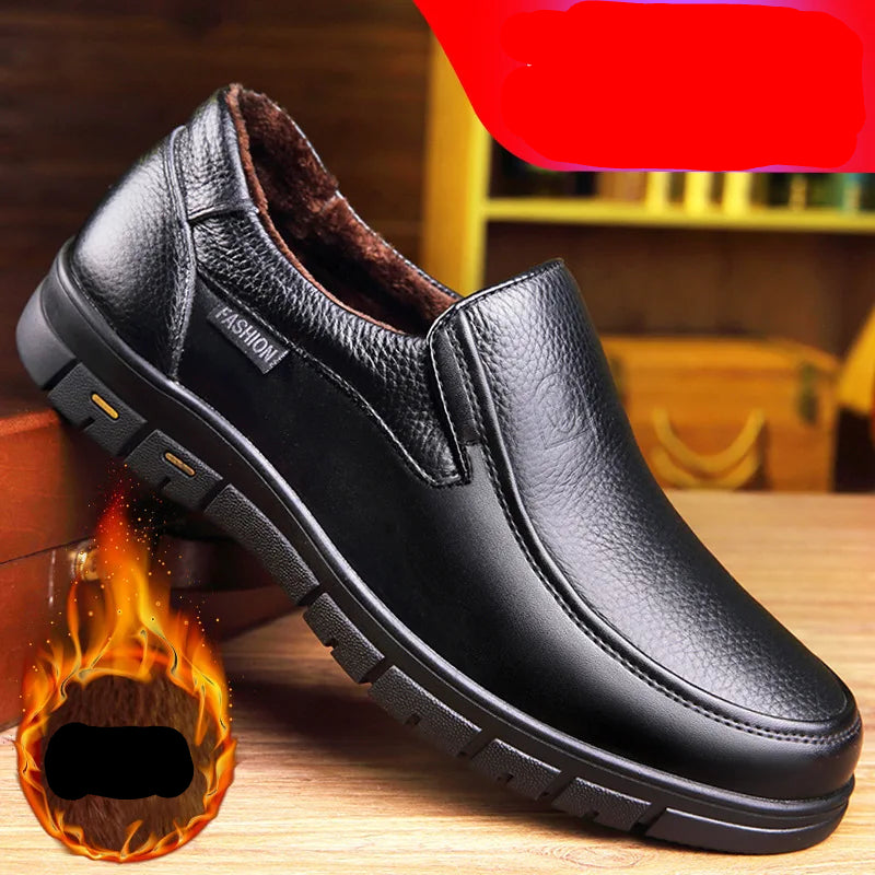 Black leather shoe with fur lining on a wooden surface, featuring text and graphics.