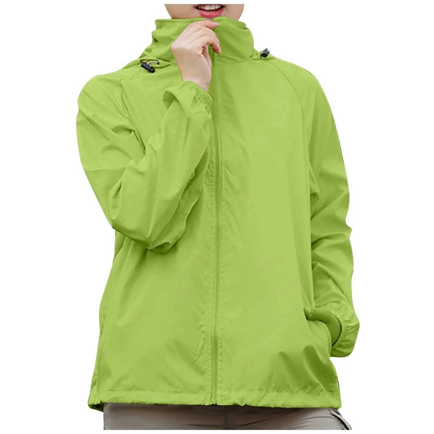Green raincoat worn by a person on a white background