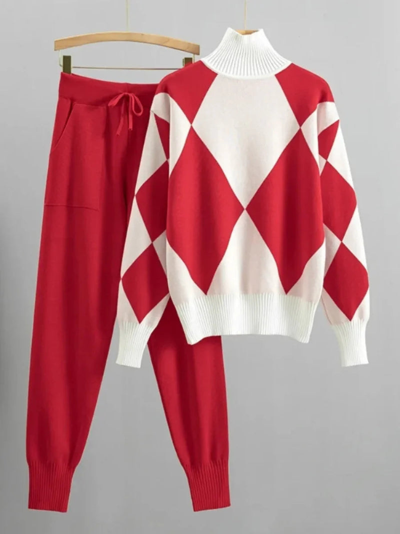 Red and white diamond pattern sweater and pants set on a gray background
